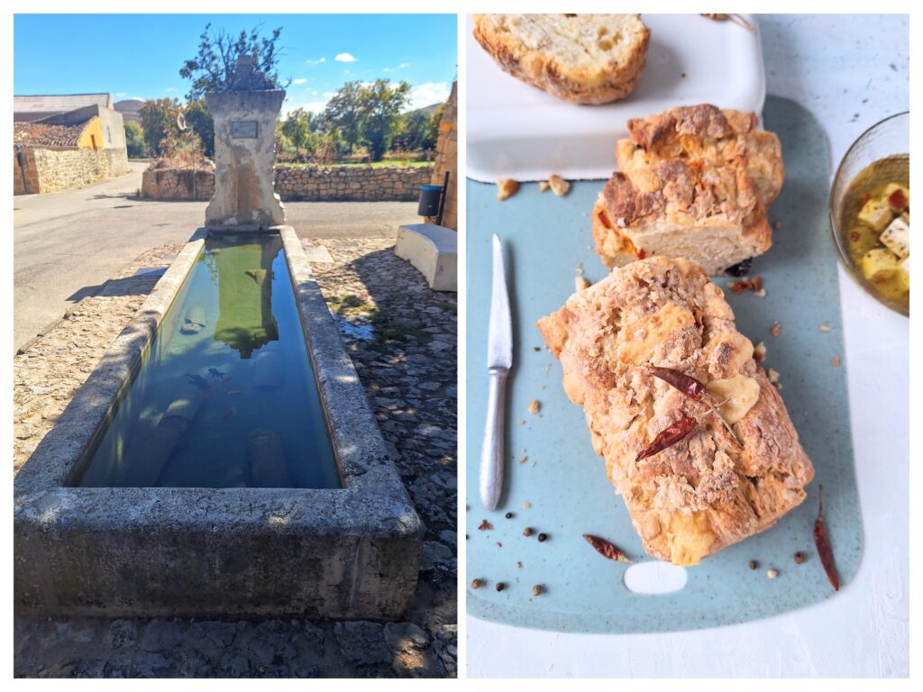 Alter Steintrug in Spanien und mediterranes Brot.