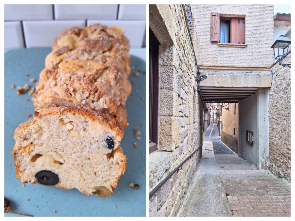 Mediterranes Oliven-Feta-Brot und eine schmale Strasse zwischen den Häusern in Spanien.
