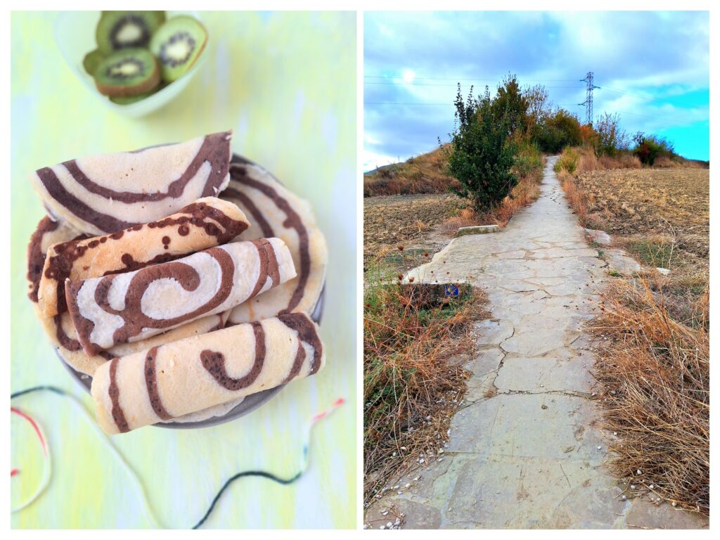 Gerollte Crepes mit Schokospirale und ein Feldweg auf Camino Frances, hinter Pamplona.